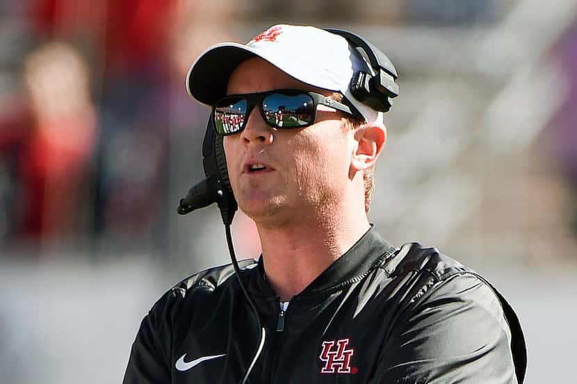 FILE - In this Nov. 24, 2017, file photo, Houston head coach Major Applewhite watches from...