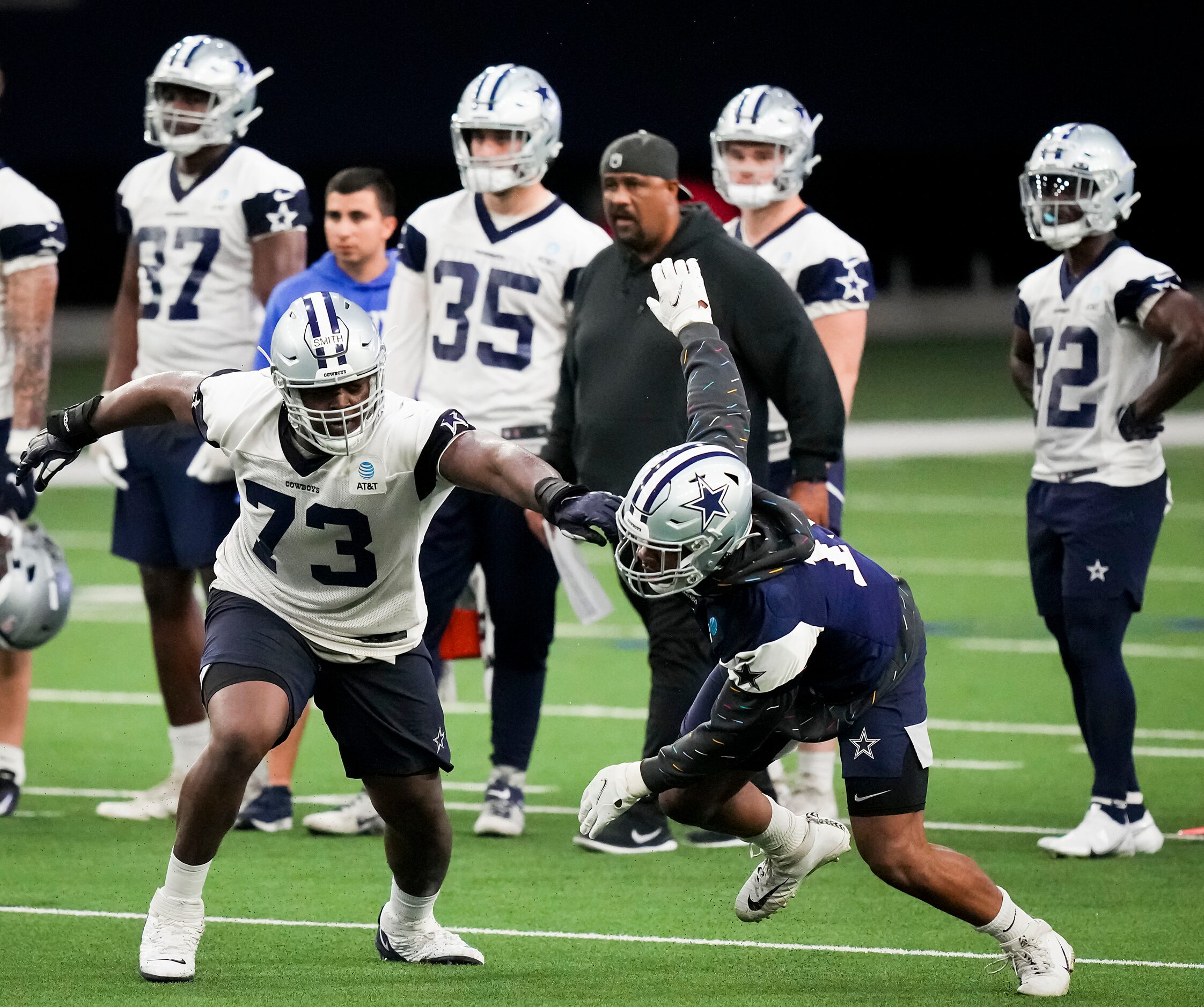 Dallas Cowboys offensive lineman Tyler Smith (73) works against linebacker Micah Parsons...