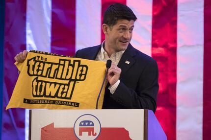 Speaker of the House Rep. Paul Ryan, R-Wis., holds a "Terrible Towel" during a breakfast...