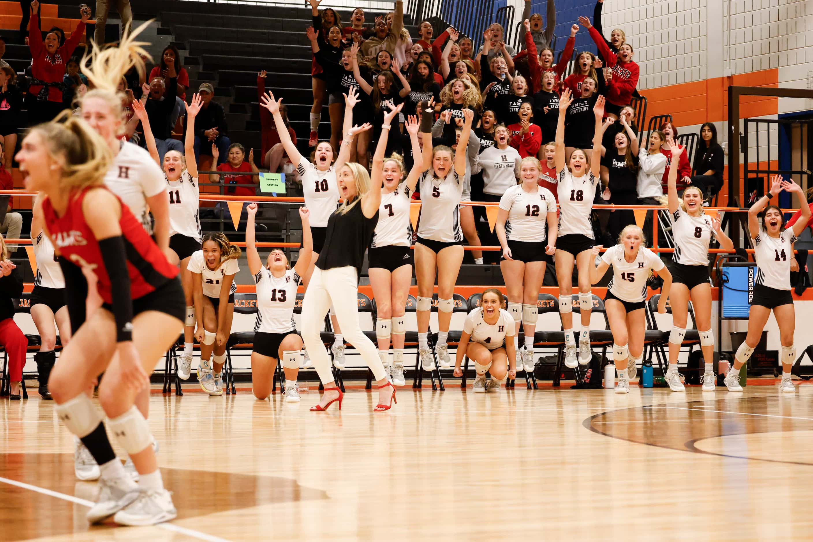Rockwall heath players cheer after winning the first set against Rockwall high during a...