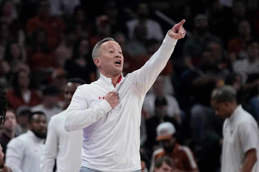 Texas Tech head coach Grant McCasland signals to his players during the first half of an...