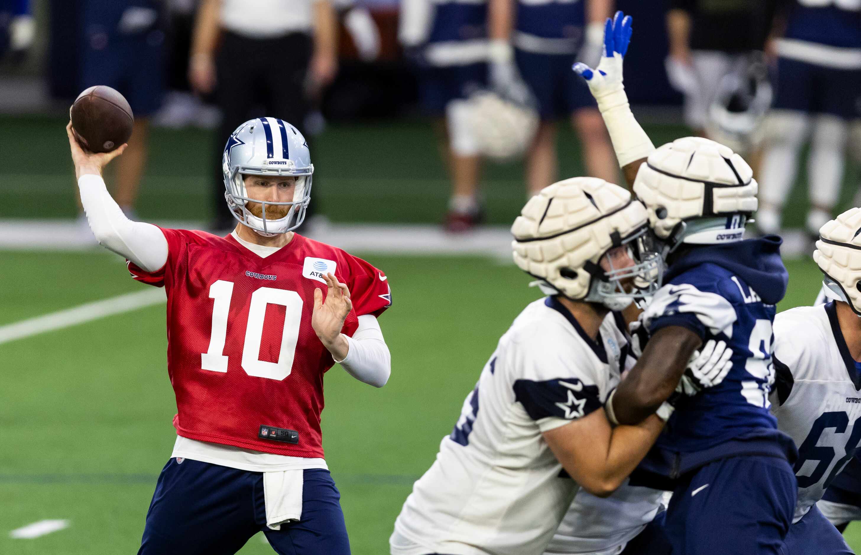 Dallas Cowboys quarterback Cooper Rush (10) throws during a minicamp practice at The Star in...