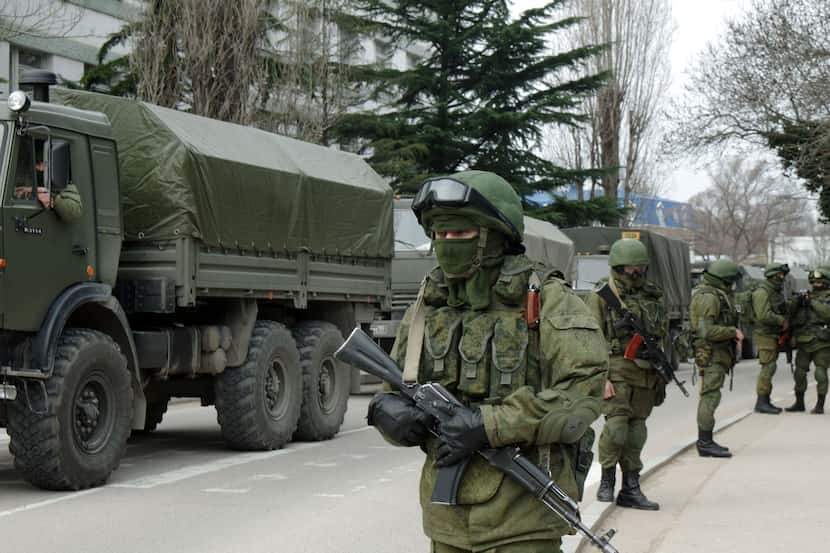 Unidentified armed individuals with armoured vehicles block the base of the Ukrainian border...