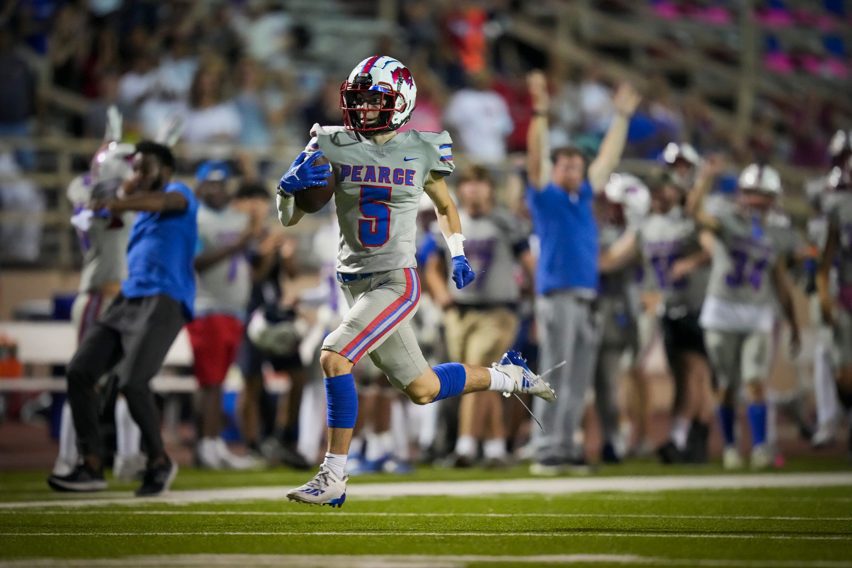 Richardson Pearce’s Jack McGarry (5) raced down the field on a 96-yard kickoff return for a...