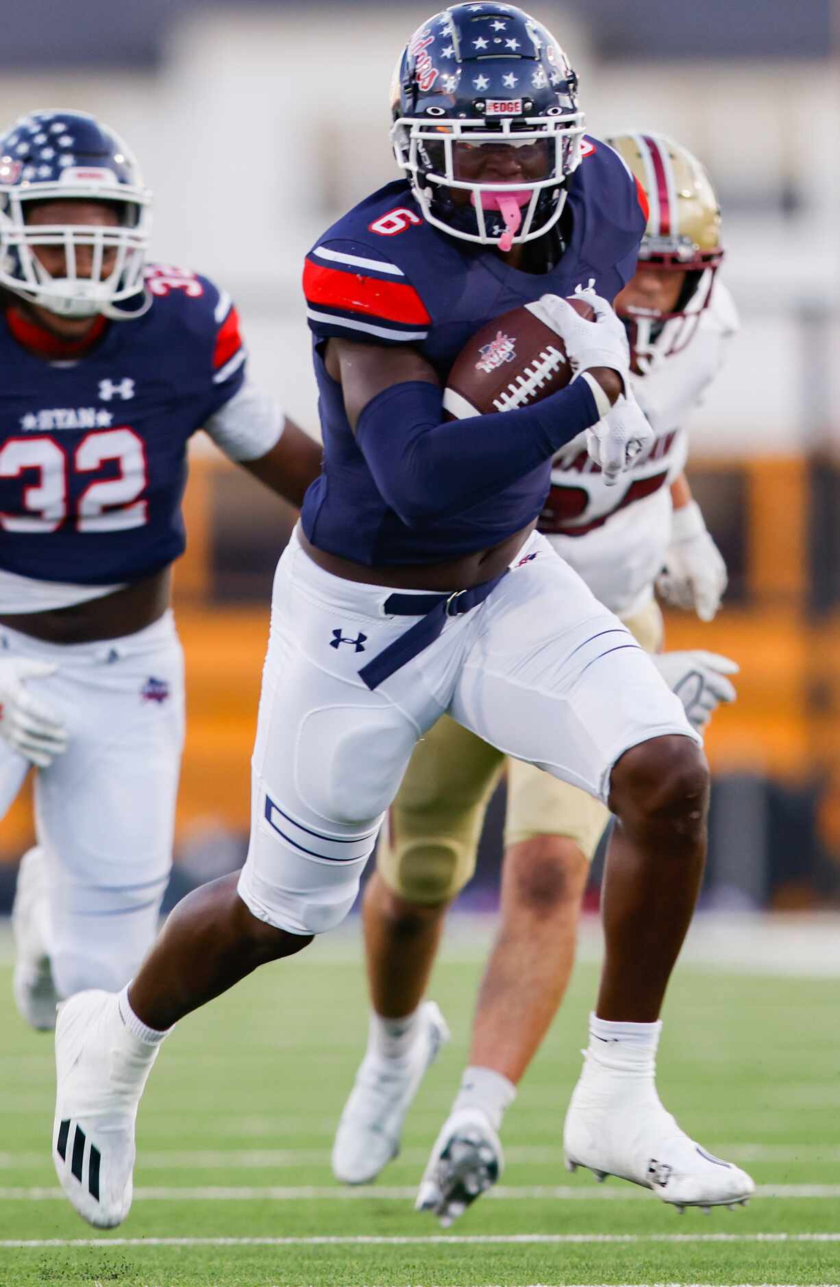 Denton Ryan’s Anthony Hill Jr. outruns the Saginaw defense for a touchdown during a District...