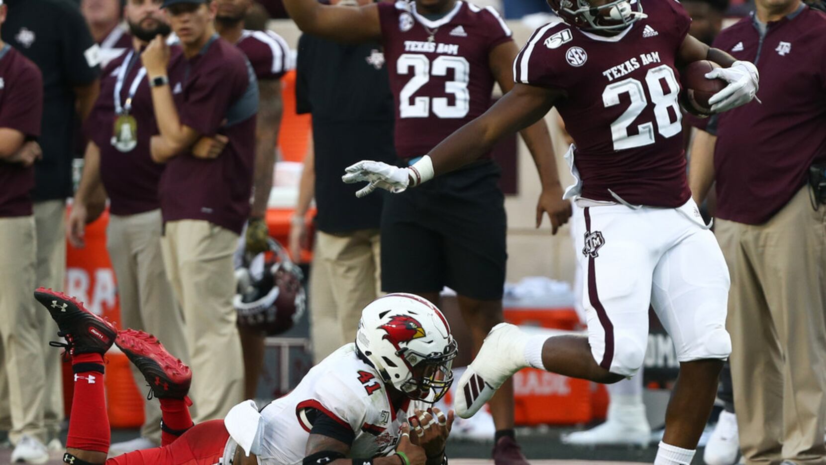 COLLEGE STATION, TEXAS - SEPTEMBER 14: Isaiah Spiller #28 of the Texas A&M Aggies is tackled...