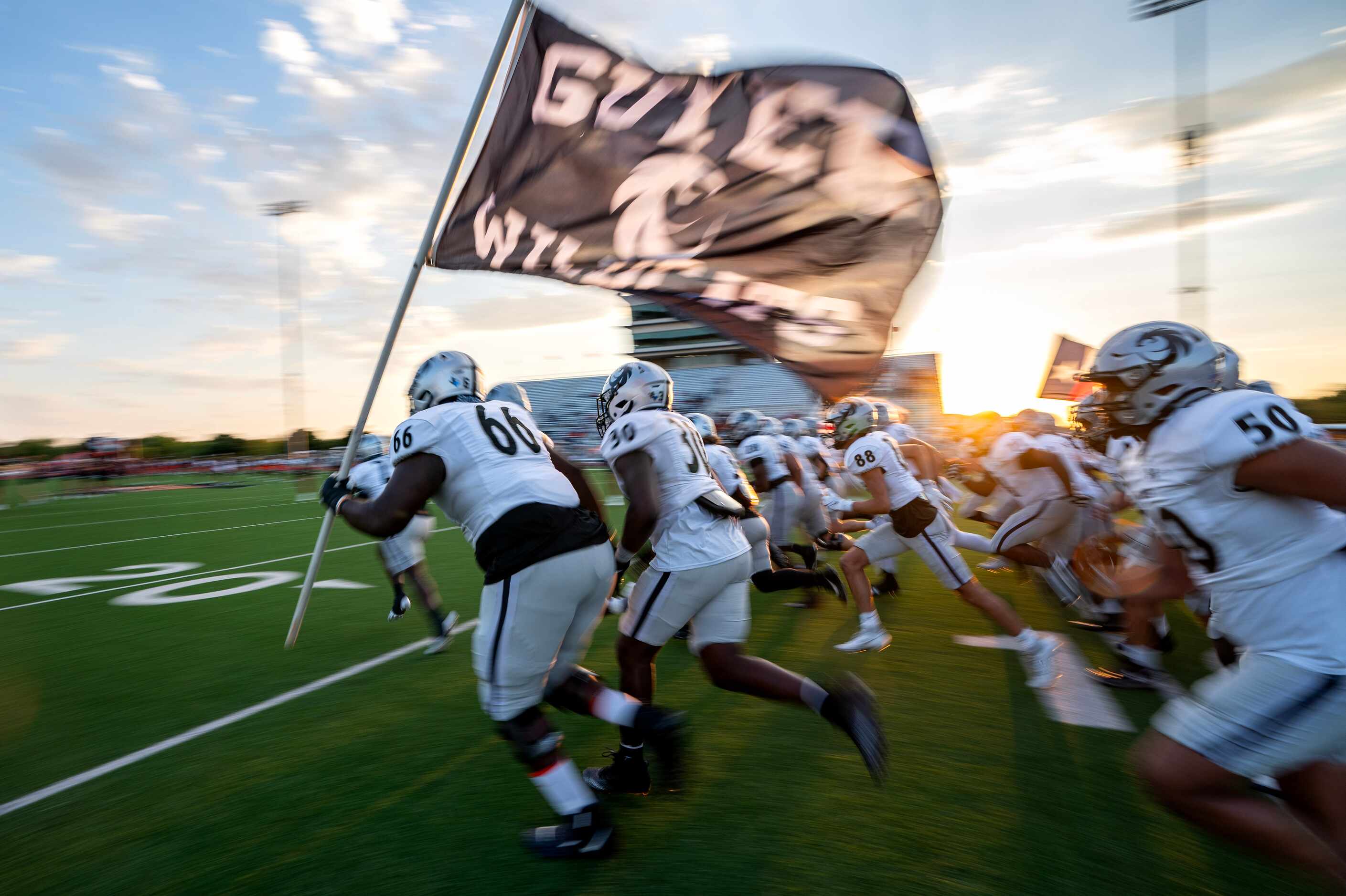 The Denton Guyer Wildcats take the field against Lancaster before a high school football...
