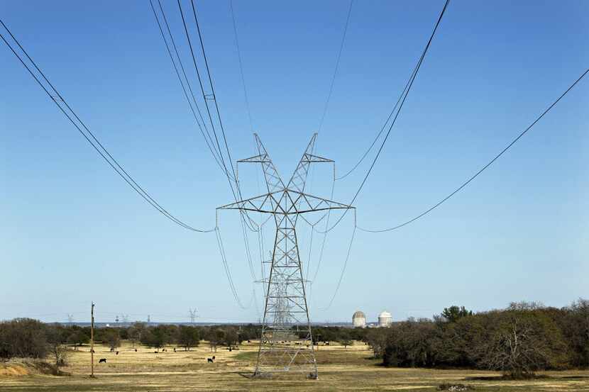 Electrical transmission lines lead to Luminant's Comanche Peak Nuclear Power Plant near Glen...