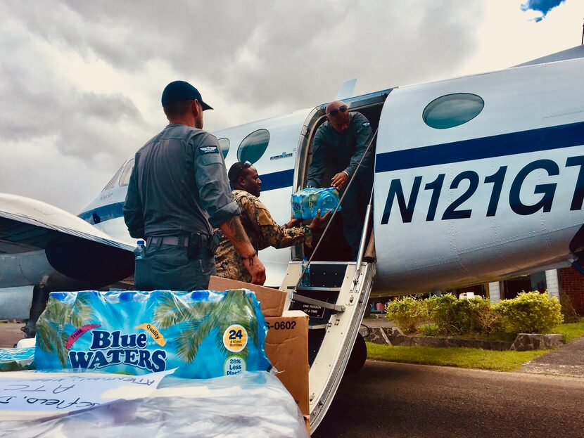 Resilience Global pilot Captain David Sexton and Pathfinder Medic Peter Barrow help unload...