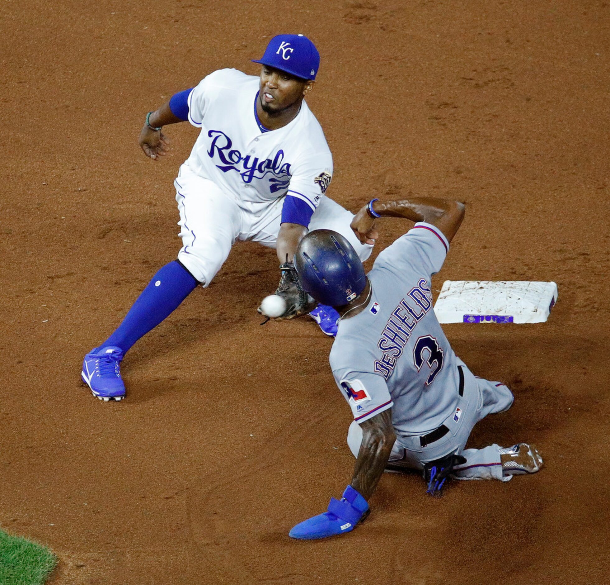 Texas Rangers' Delino DeShields (3) is caught stealing second by Kansas City Royals...