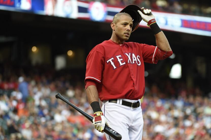 Texas Rangers right fielder Alex Rios (51) strikes out in the  second inning during their...