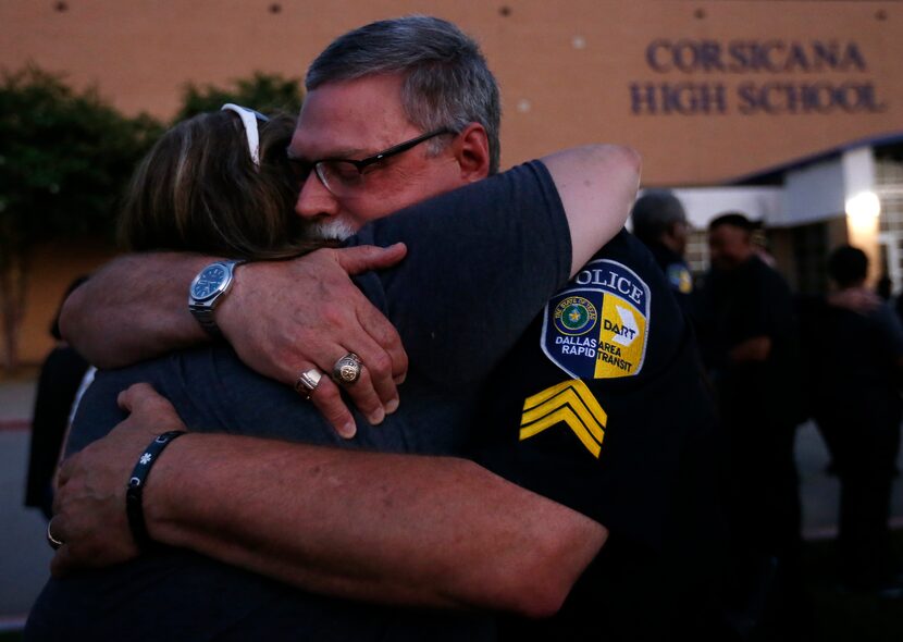 Dallas Area Rapid Transit officer Richard Tear (right) and fellow officer Melanie Cade...