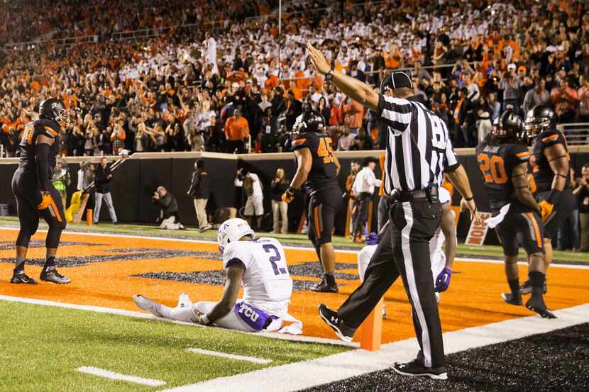 TCU quarterback Trevone Boykin (2) sits at the goal line and watches the Oklahoma State...