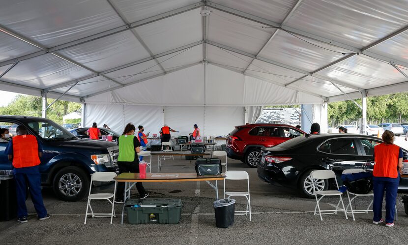 Even on its last day, the Fair Park mega vaccination site kept health-care workers busy...