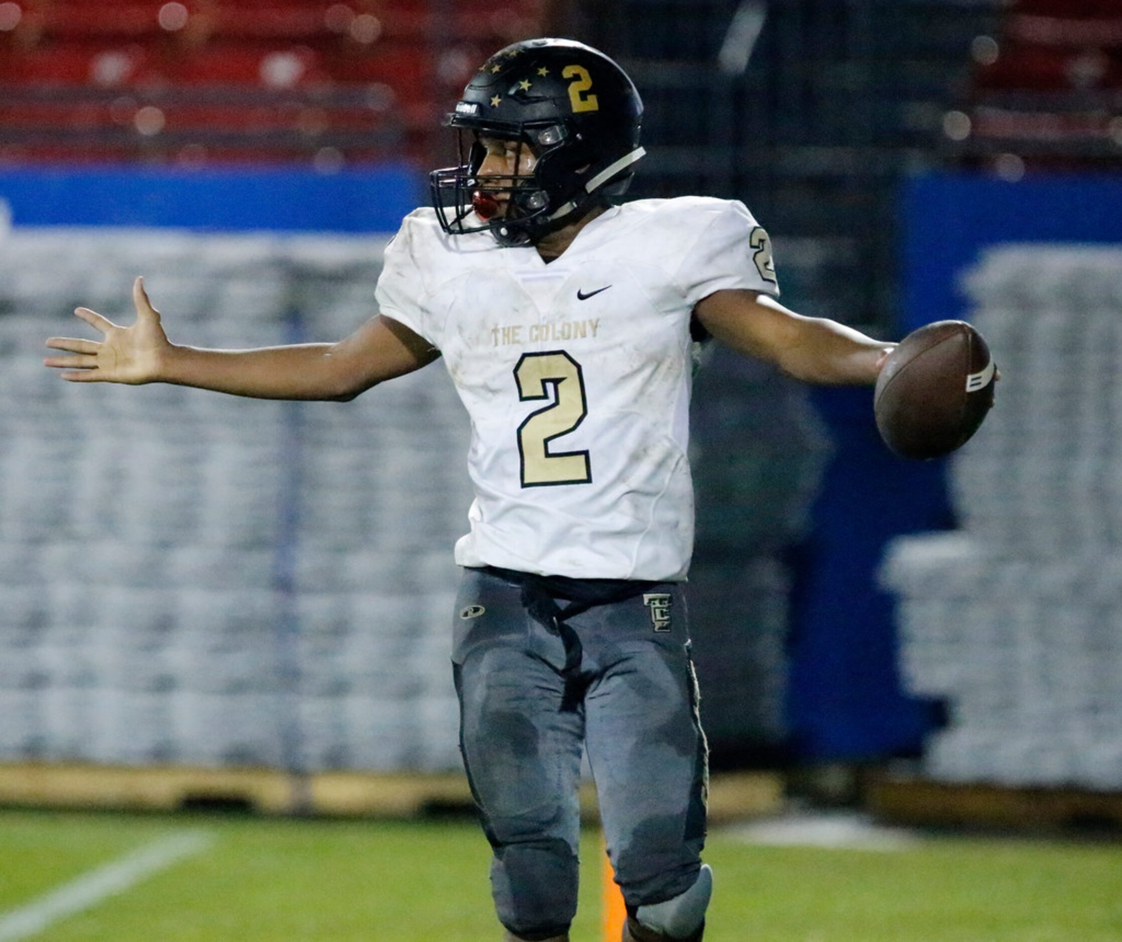 The Colony High School running back Myles Price (2) takes a lateral into the end zone with...