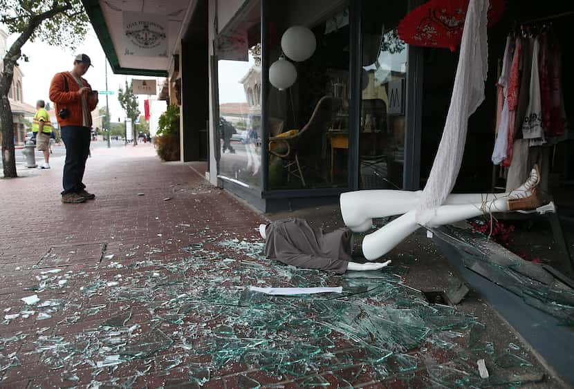 NAPA, CA - AUGUST 24:  A mannequin lays in broken glass in front of a damaged buillding...