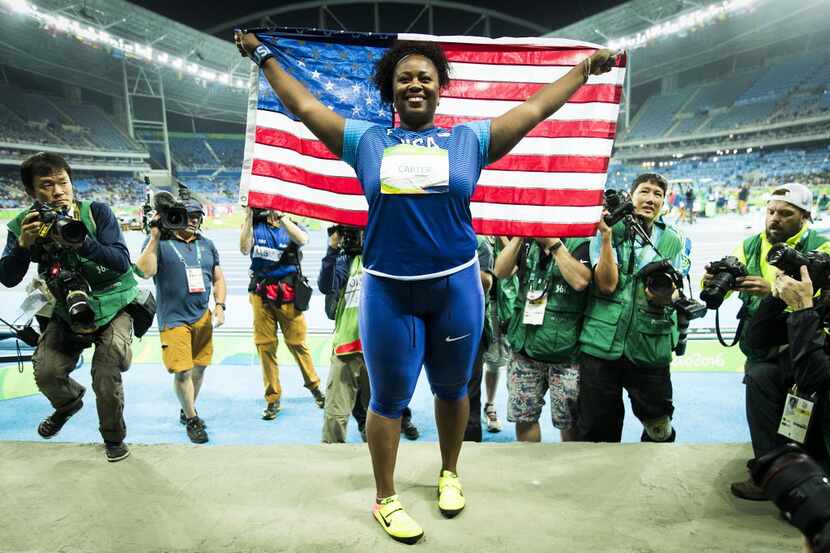 FILE - Michelle Carter celebrates after winning the women's shot put gold medal on the first...