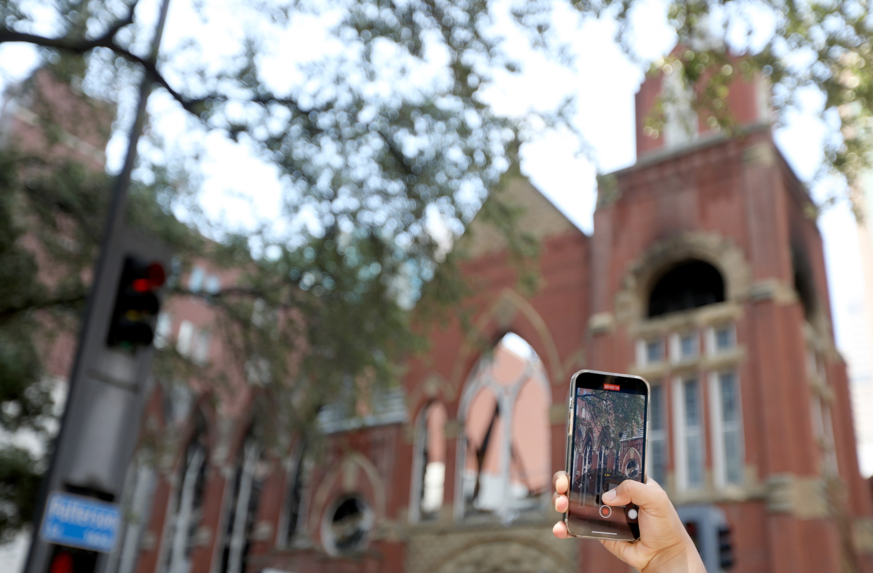 A man takes a video at First Baptist Church in Dallas, Texas, Sunday, July 21, 2024 after a...