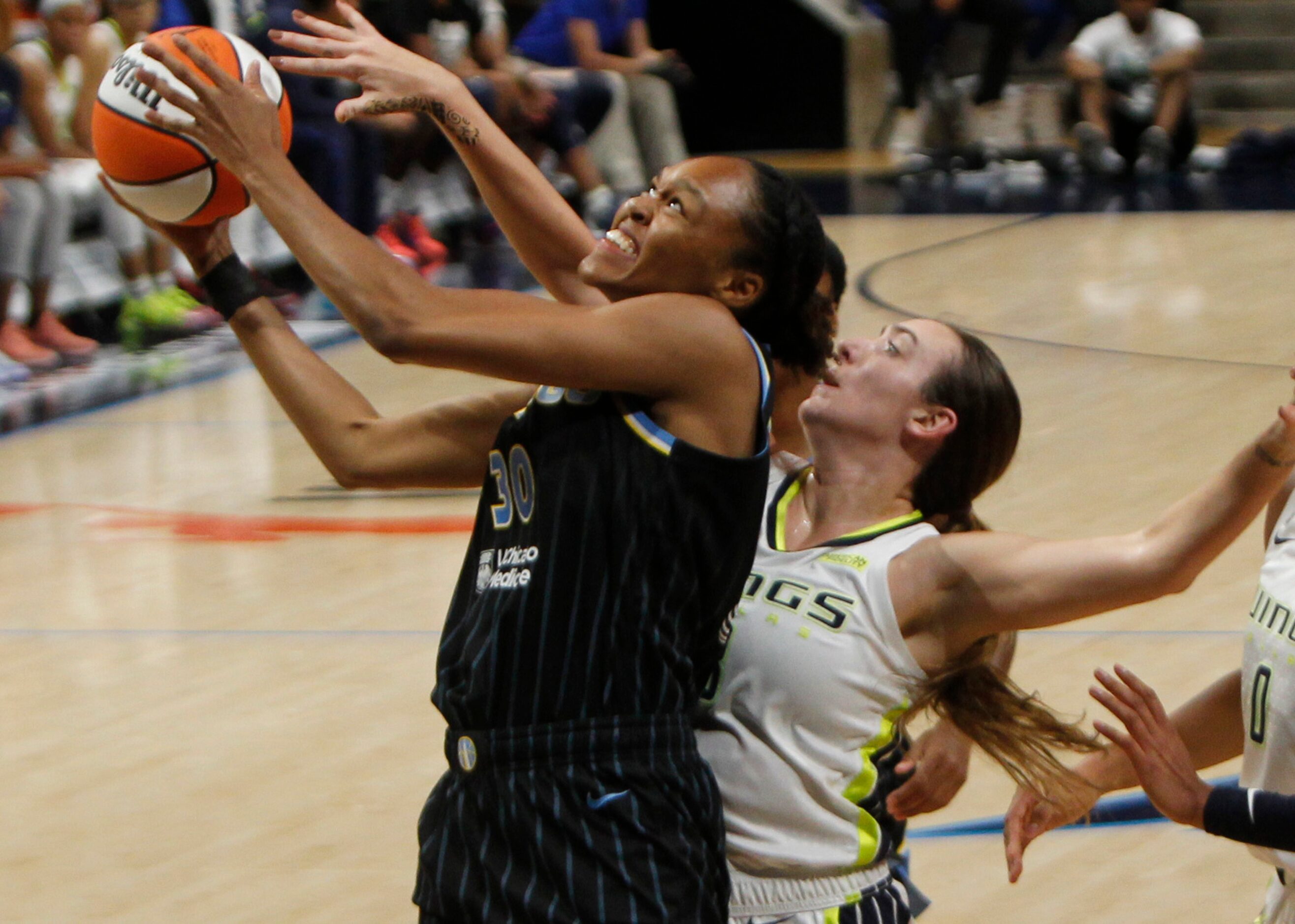 Chicago Sky forward Azura Stevens (30) drives and shoots as Dallas Wings guard Marina Mabrey...