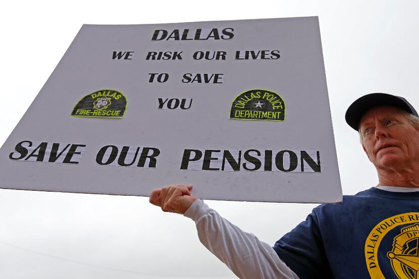 Andy Paris, a retired Dallas police officer, joined a rally to support the pension last...