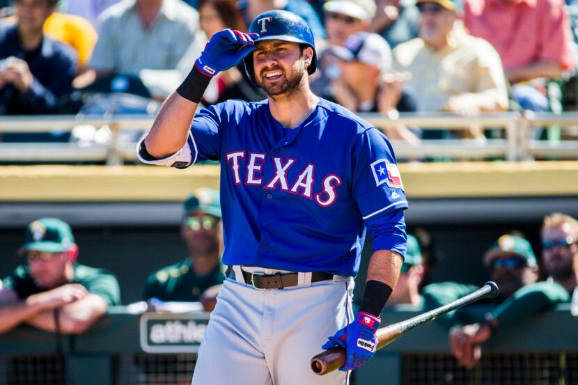 Texas Rangers designated hitter Joey Gallo (13) walks back to the dugout after striking out...