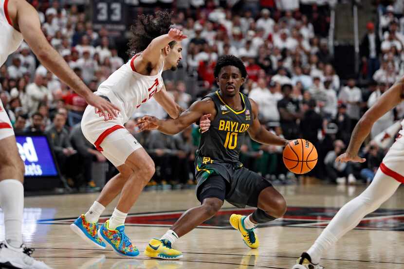 Baylor's Adam Flagler (10) steps back away from Texas Tech's Pop Isaacs (2) during the first...