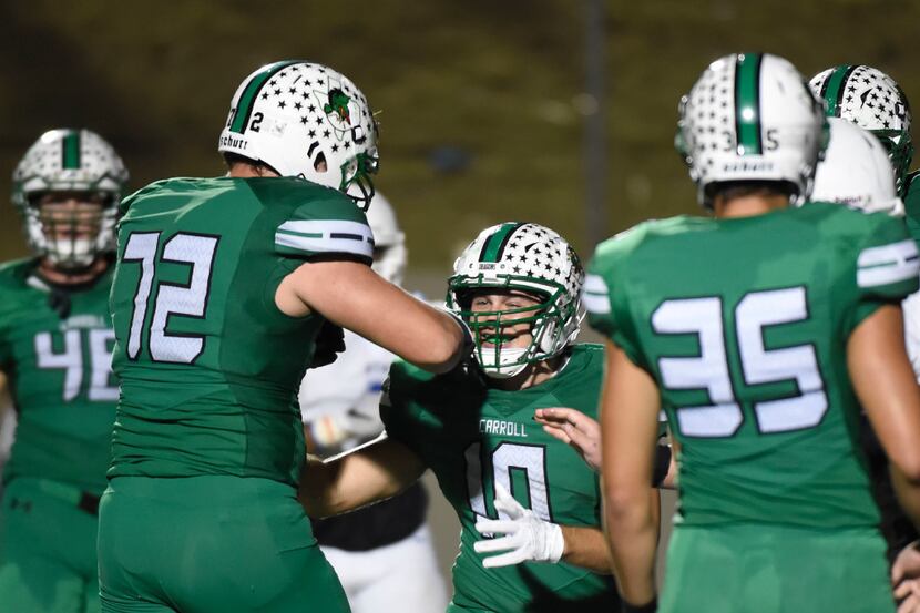 Jackson Kimble (72) celebrates with Jack Johansson (1) after he scores a touchdown against...