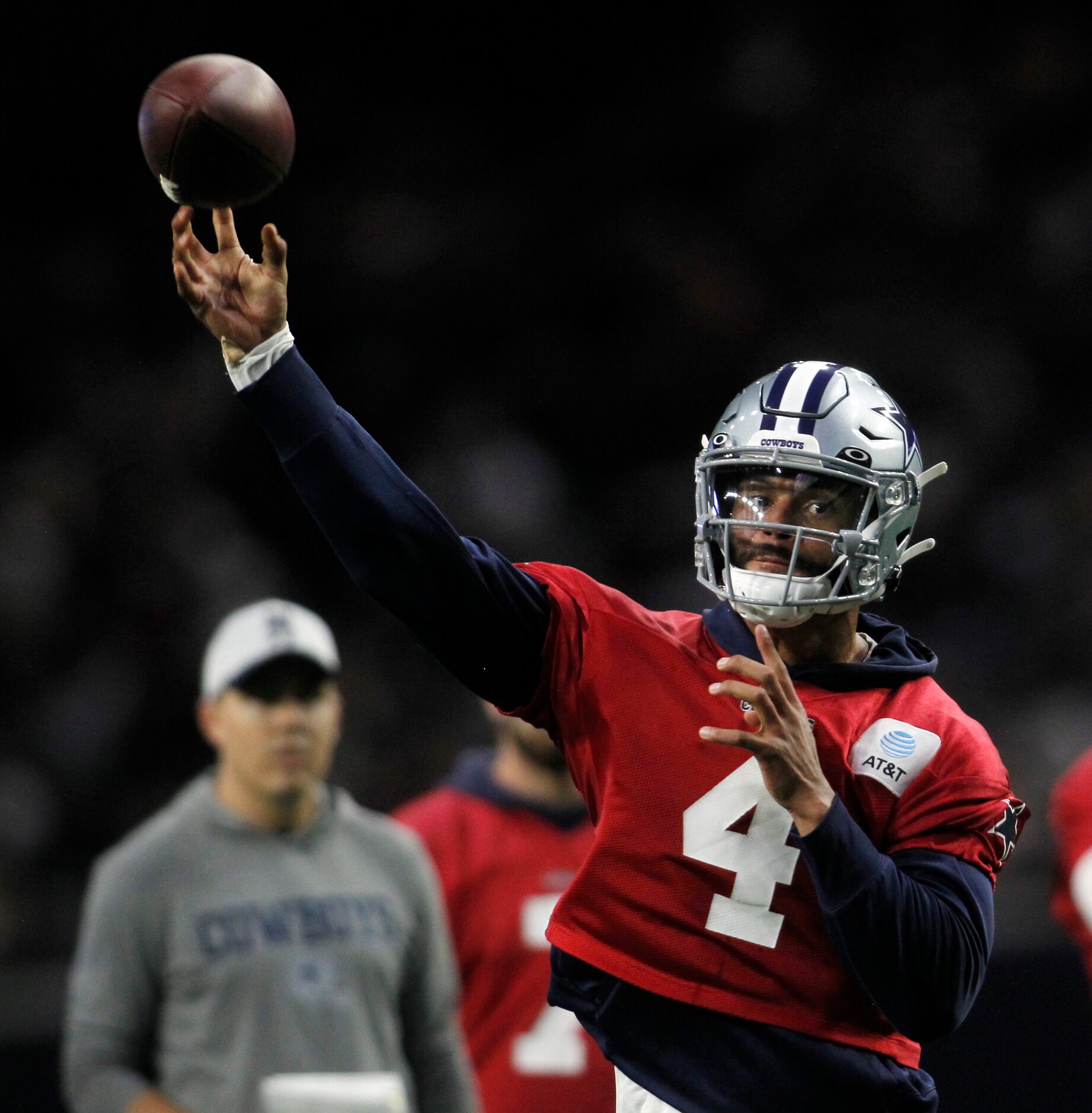 Dallas Cowboys quarterback Dak Prescott (4) launches a pass downfield during a team practice...