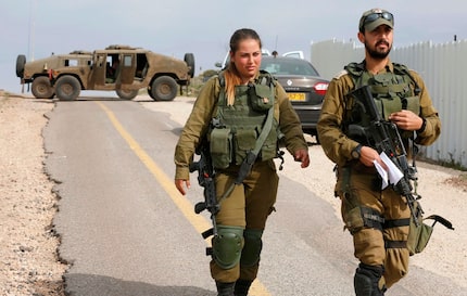 Israeli soldiers block a road in the Israeli-annexed Golan Heights on Feb. 10. Israel struck...