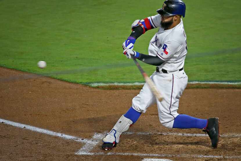 Texas Rangers second baseman Rougned Odor (12) hits a two-run home run against Boston Red...