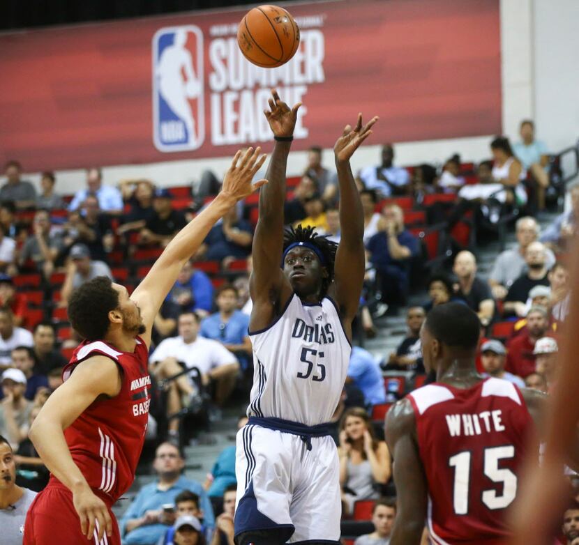 Dallas Mavericks' Johnathan Motley (55) shoots against the Miami Heat during a basketball...