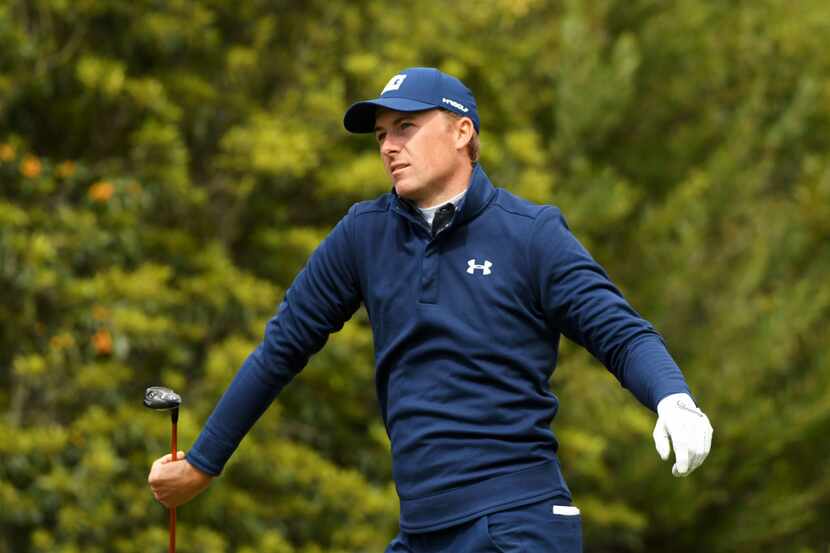 PACIFIC PALISADES, CALIFORNIA - FEBRUARY 17: Jordan Spieth catches his club after hitting an...