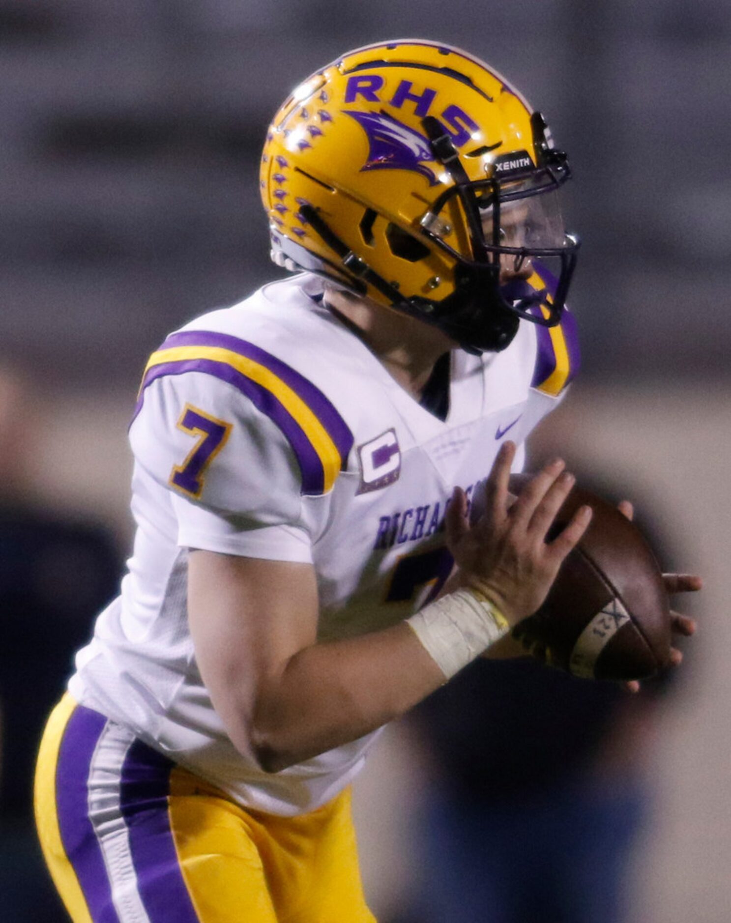 Richardson quarterback Luke Mulvey (7) rolls out of the pocket as he looks to throw during...