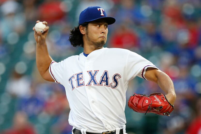 Texas Rangers pitcher Yu Darvish works against the Oakland Athletics during the first inning...