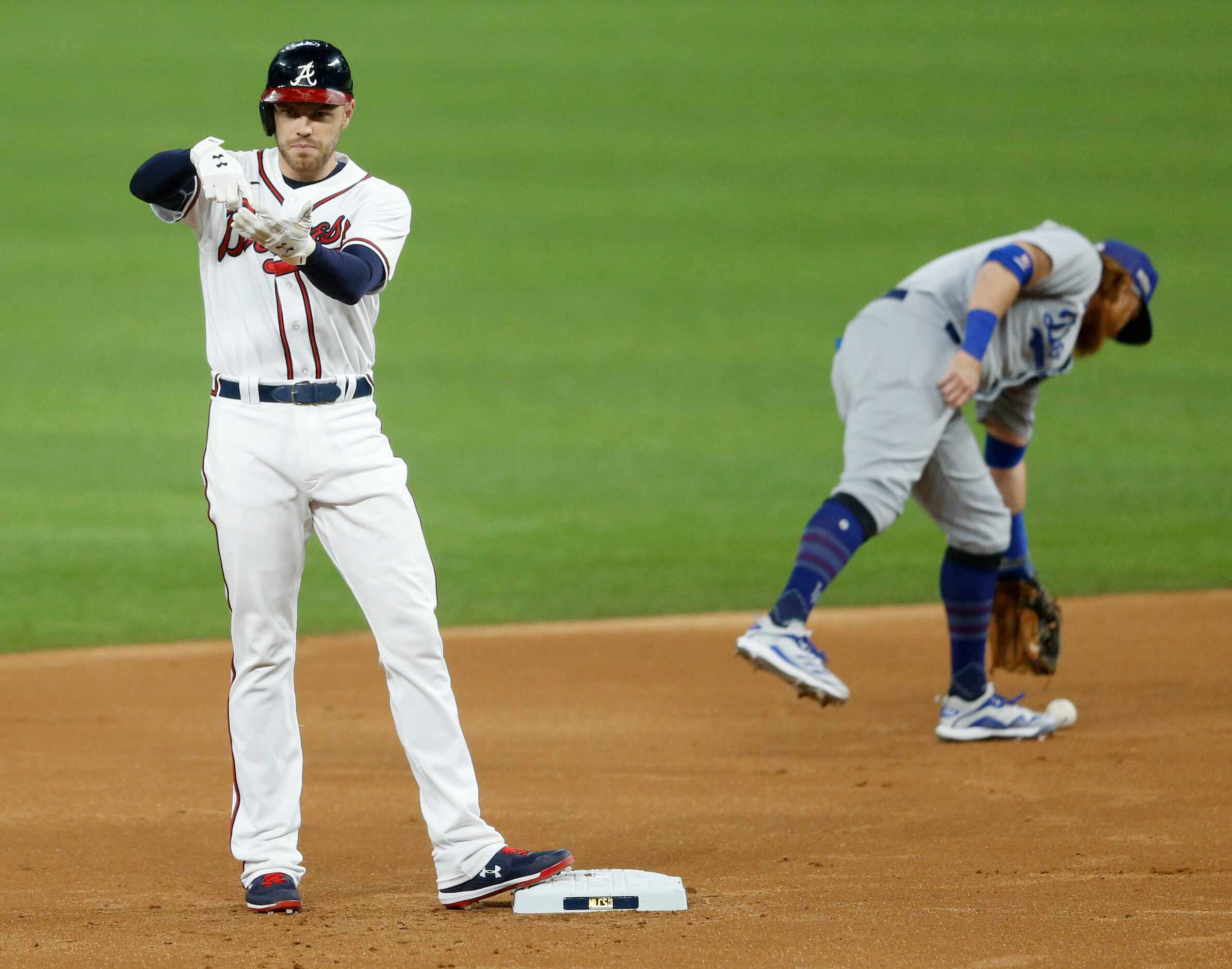 Atlanta Braves first baseman Freddie Freeman (5) celebrates after hitting a double as Los...