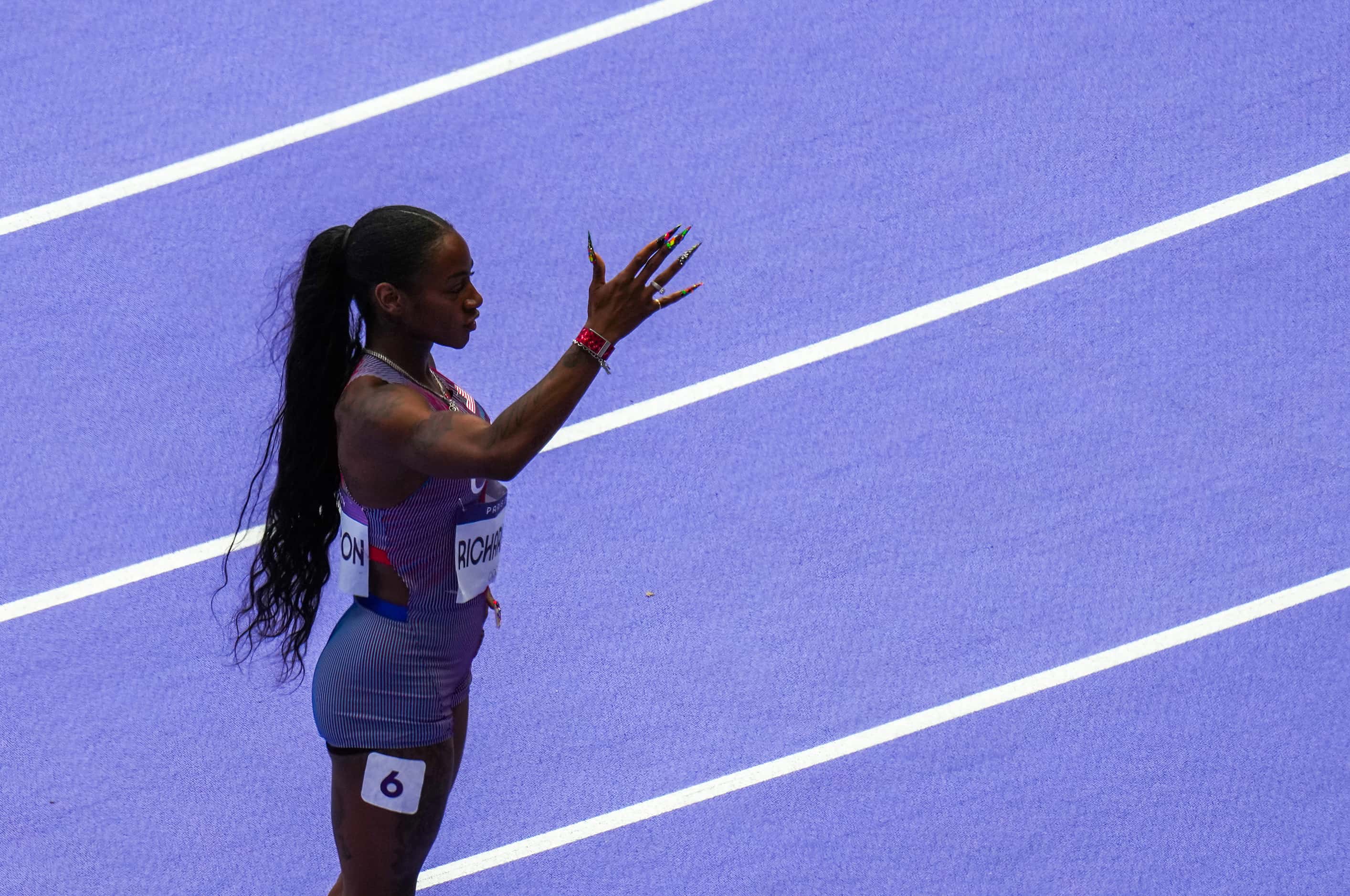 Sha'carri Richardson of the United States motions to the crowd after winning her heat of the...