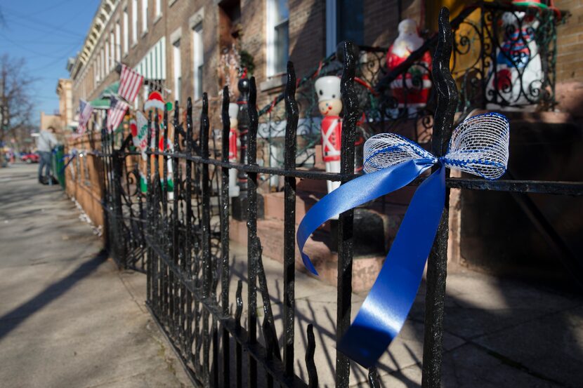 Blue ribbons adorn 64 Place near Christ Tabernacle Church, in the Glendale section of...