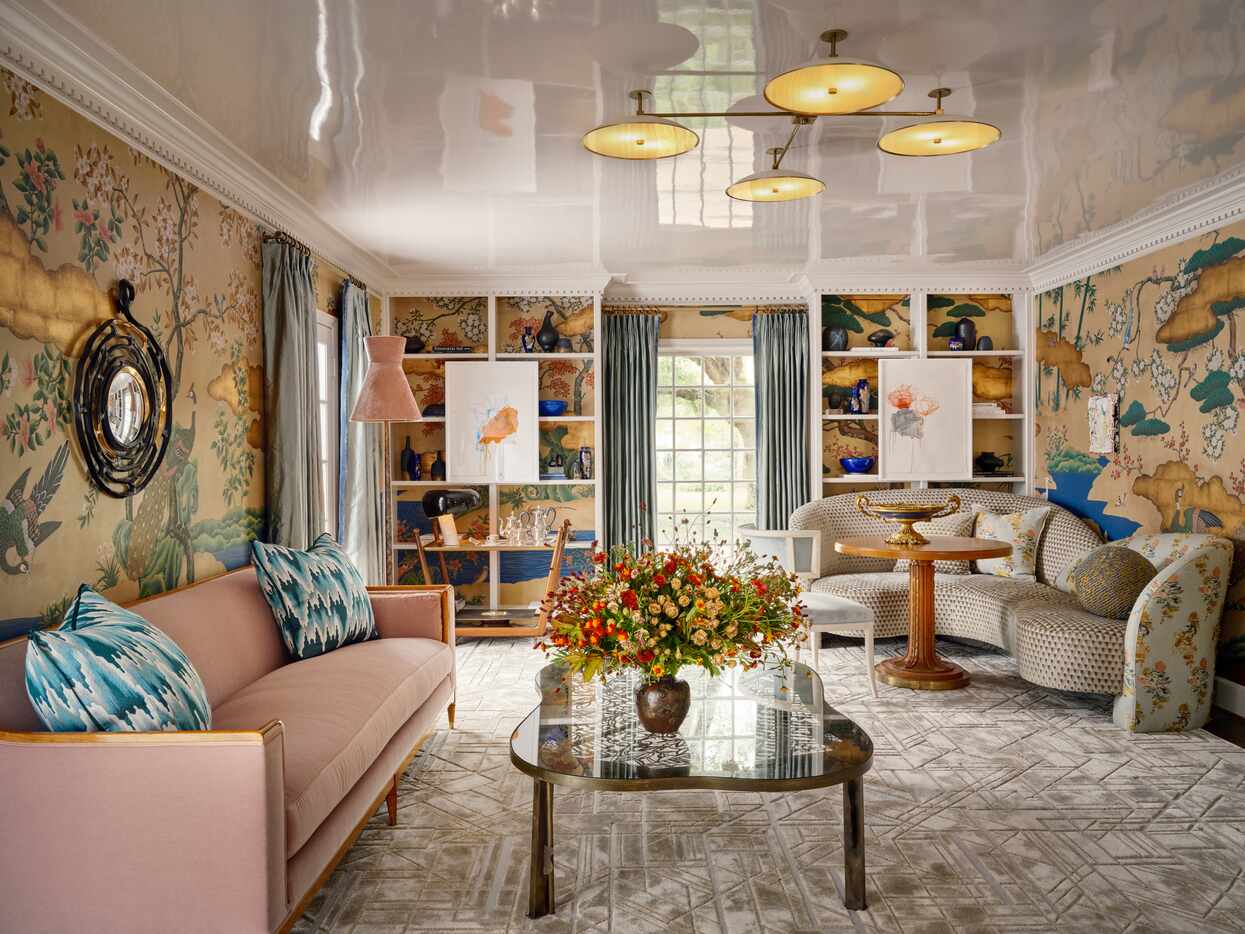 The living room, designed by Laura Lee Clark of Laura Lee Clark Design, was centered around...