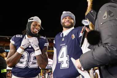 Dallas Cowboys wide receiver CeeDee Lamb (88) and quarterback Dak Prescott (4) smile as...
