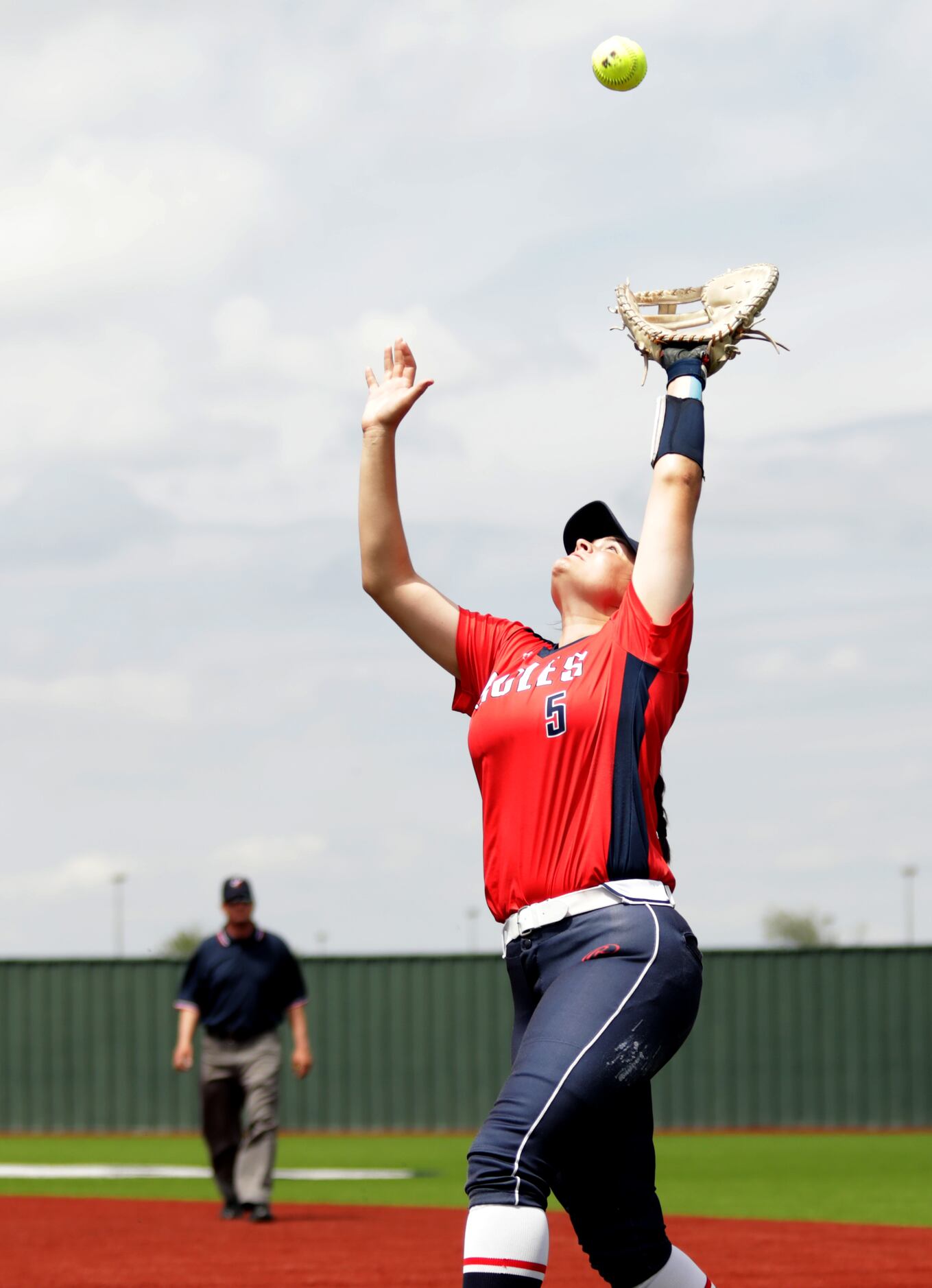 Allen High School player #5, Brooklyn Purtell, takes out a Flower Mound High School hitter...