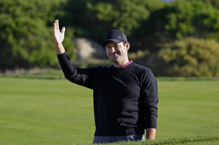 FILE - In this Feb. 9, 2018, file photo, Tony Romo waves after hitting the ball out of a...