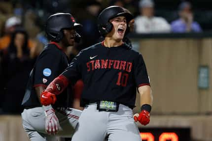 Stanford catcher Malcolm Moore (10) celebrates after scoring against Texas in the ninth...