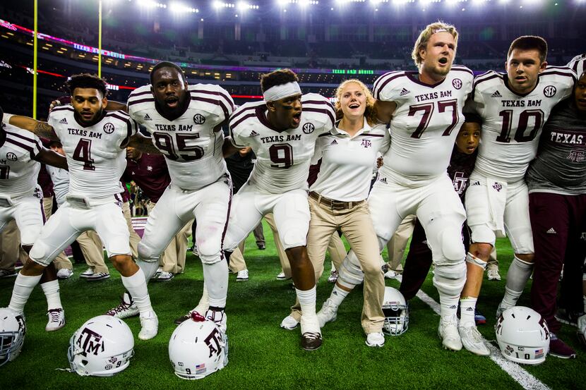 The Texas A&M Aggies celebrate a 28-21 win over the Arkansas Razorbacks after their game on...