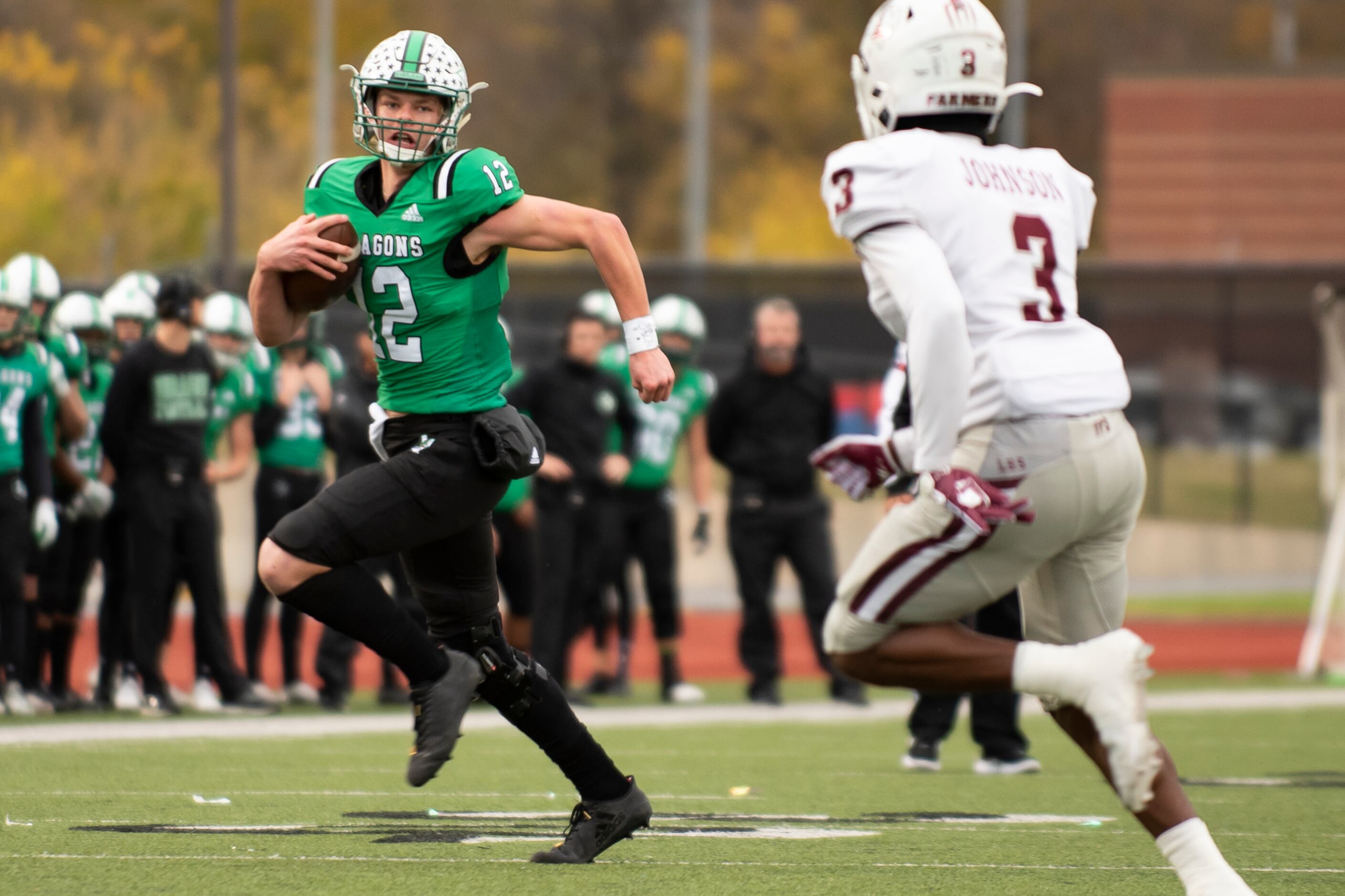 Southlake Carroll junior Kaden Anderson (12) rushes down the field as Lewisville senior...