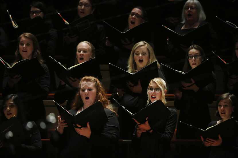 Dallas Symphony Chorus performs while Jaap van Zweden conducts Symphony No. 9 by Beethoven...