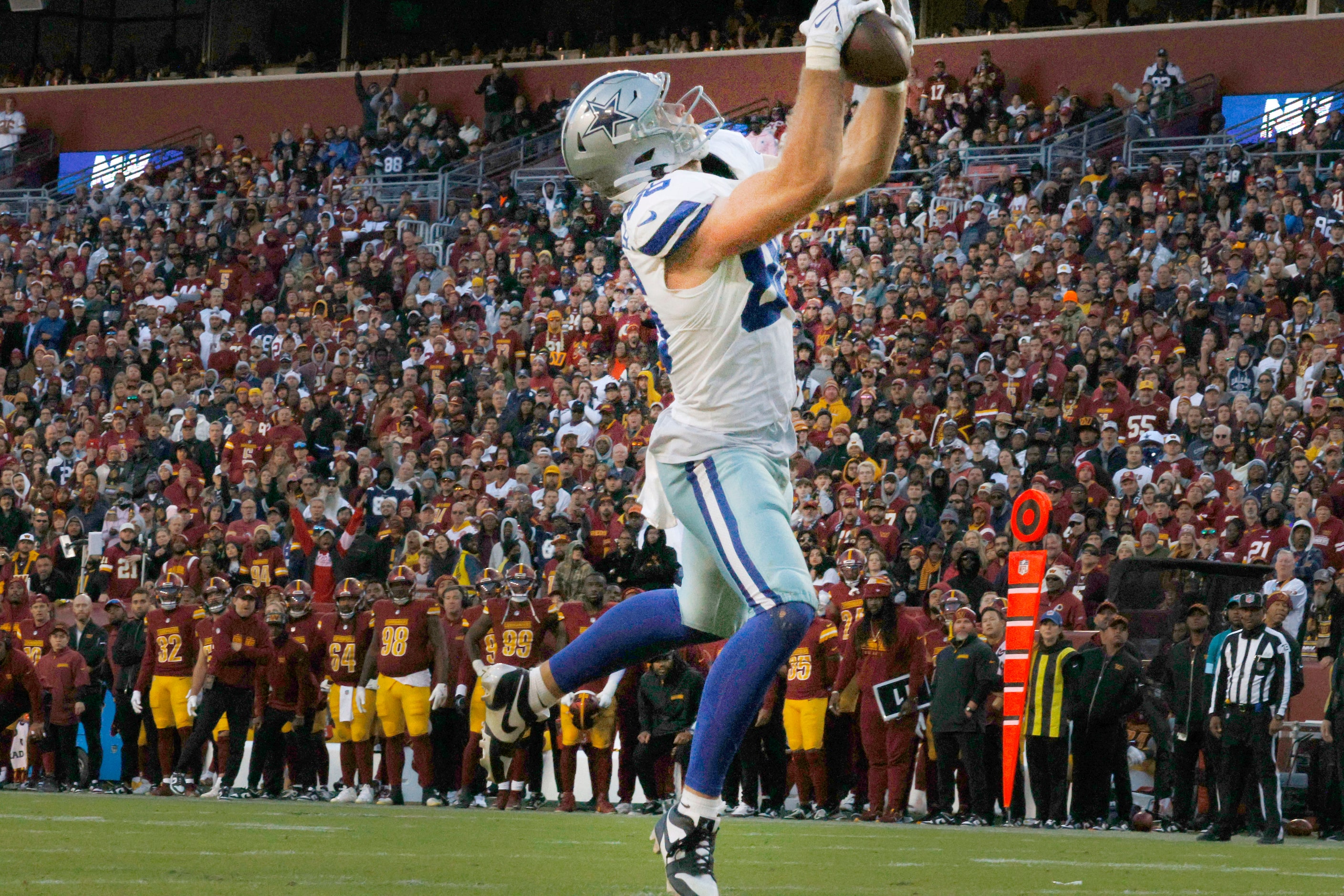 Dallas Cowboys tight end Luke Schoonmaker (86) receives a touchdown pass in the second half...