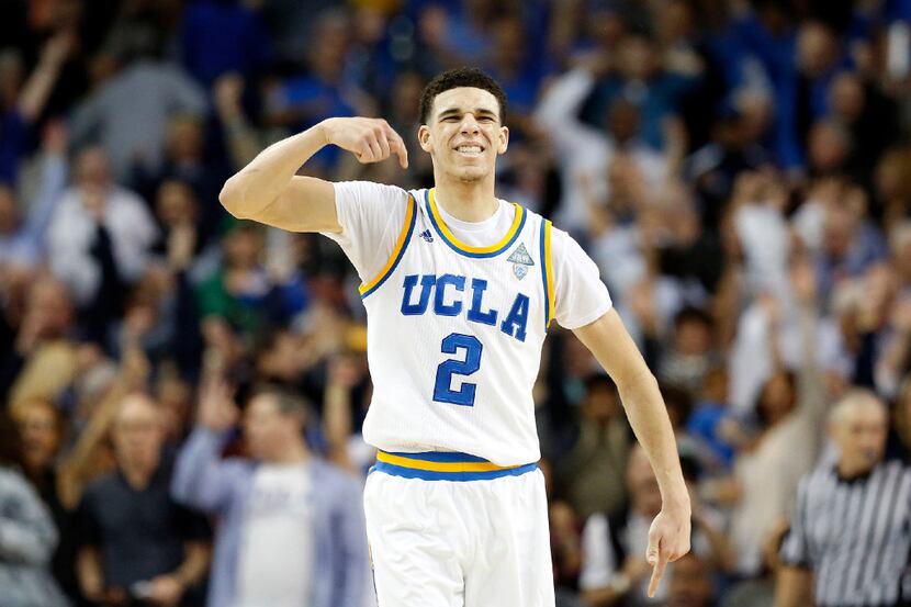 UCLA's Lonzo Ball (2) celebrates after hitting a 3-point basket late in the second half...