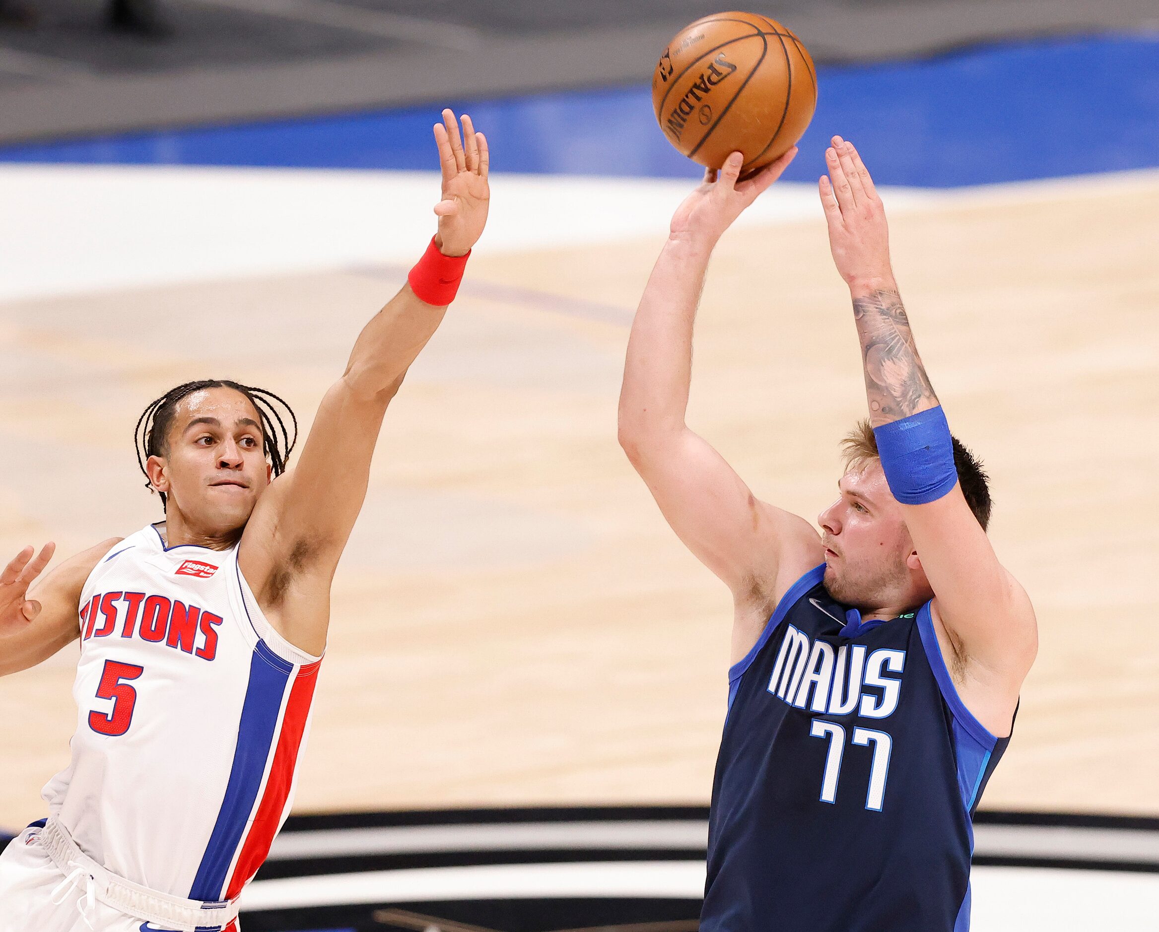 Dallas Mavericks guard Luka Doncic (77) puts up a there-pointer against Detroit Pistons...