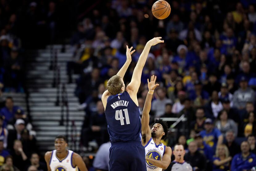 Dallas Mavericks' Dirk Nowitzki (41) shoots against the Golden State Warriors during the...