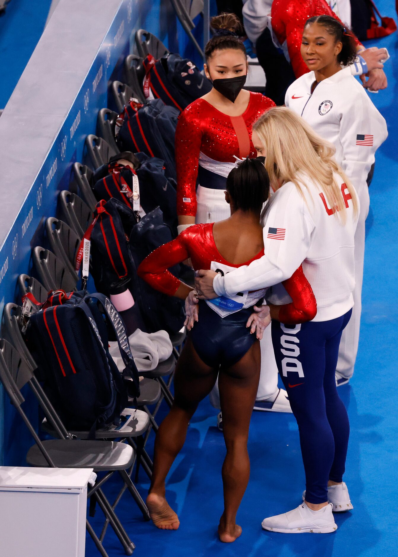 USA’s  Simone Biles gets a hug from her coach Cecile Landi after competing on the vault...